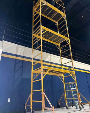 Rolling scaffold tower rental with locking casters for indoor work
